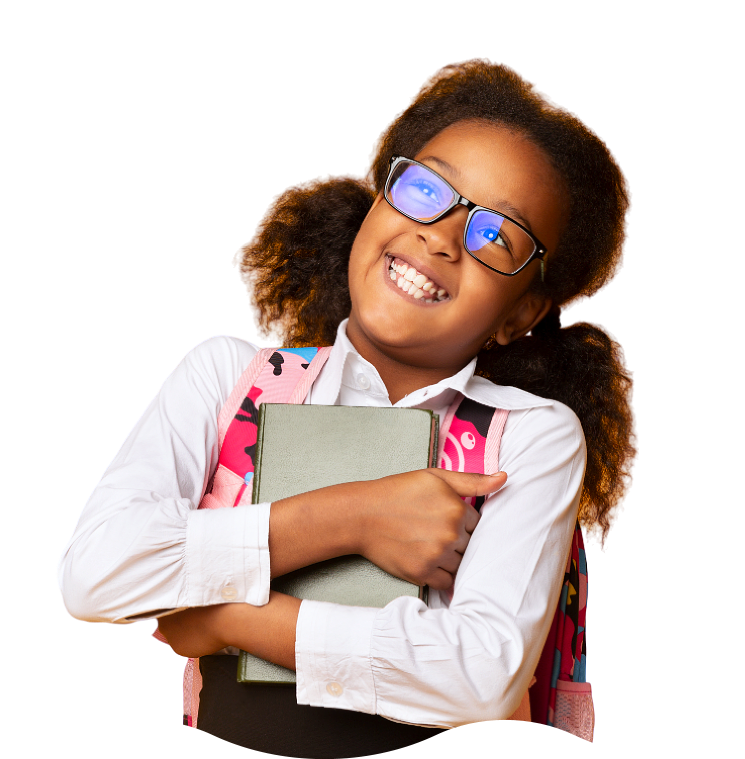 little girl smiling while holding a book