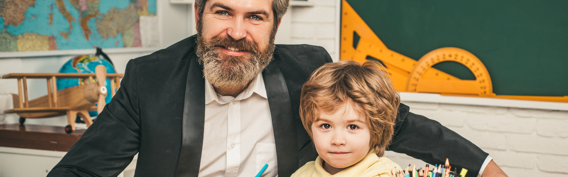 man and kid smiling