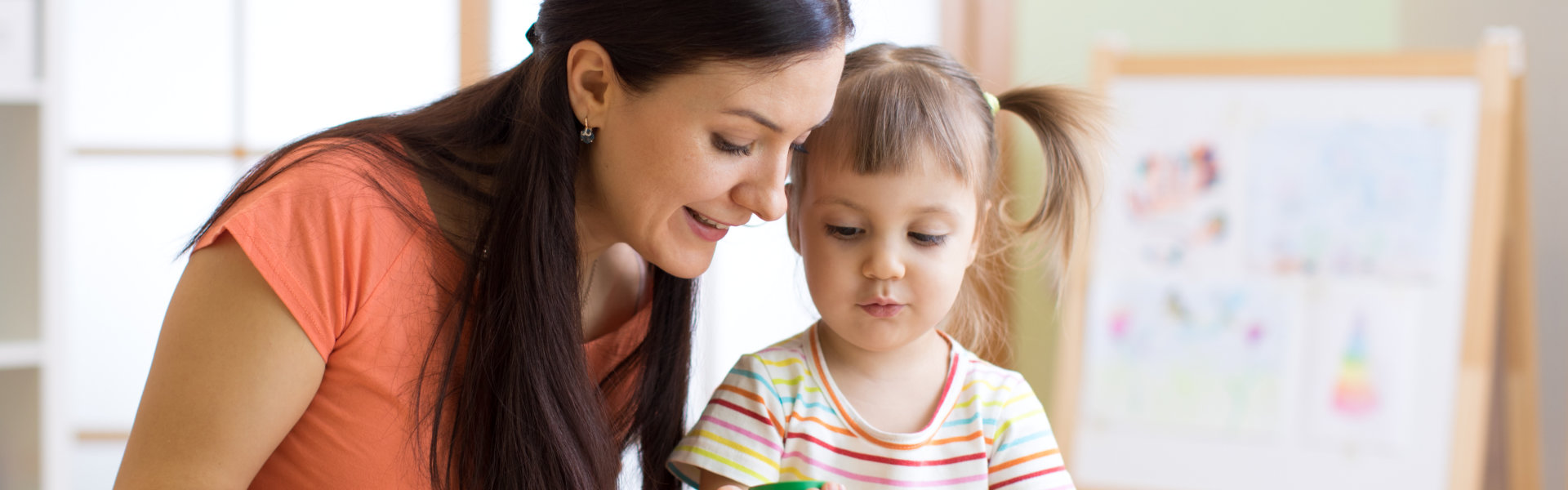 woman and little girl smiling