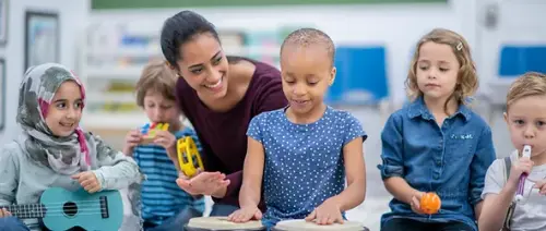 teacher assisting child